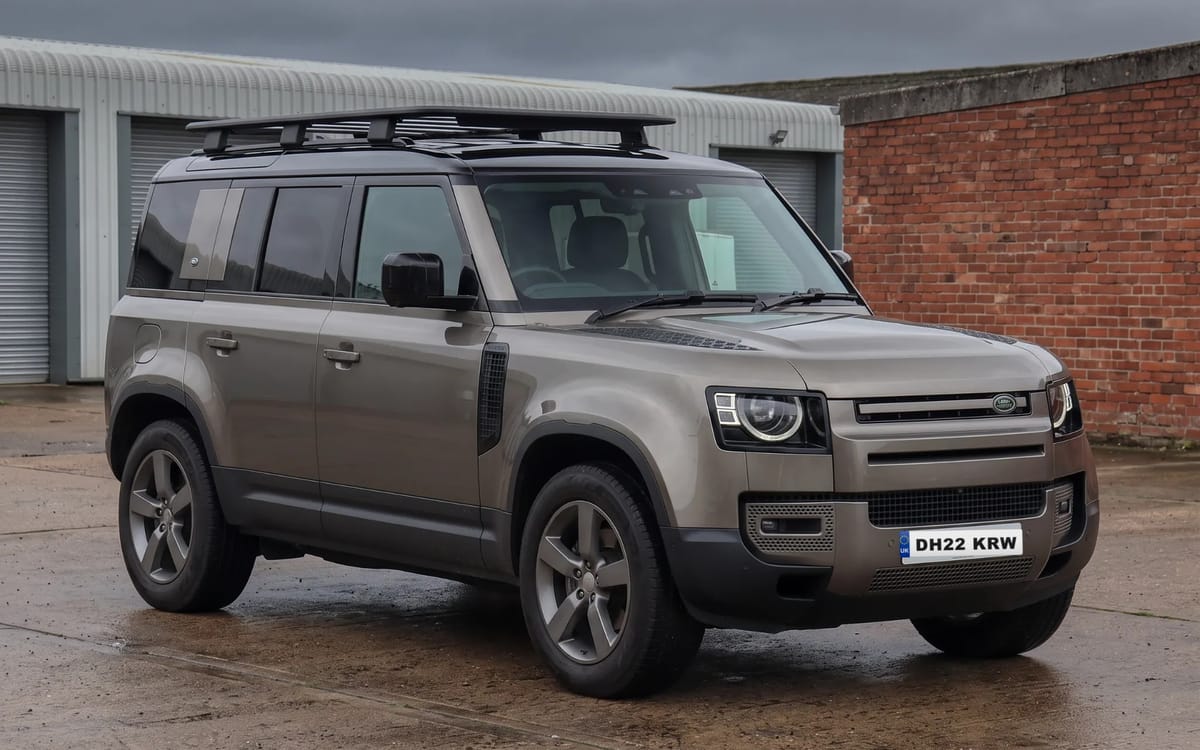 Land Rover Defender 110 D300 X-Dynamic HSE in Gondwana Stone with Narvik Black contrast roof, front three-quarter view