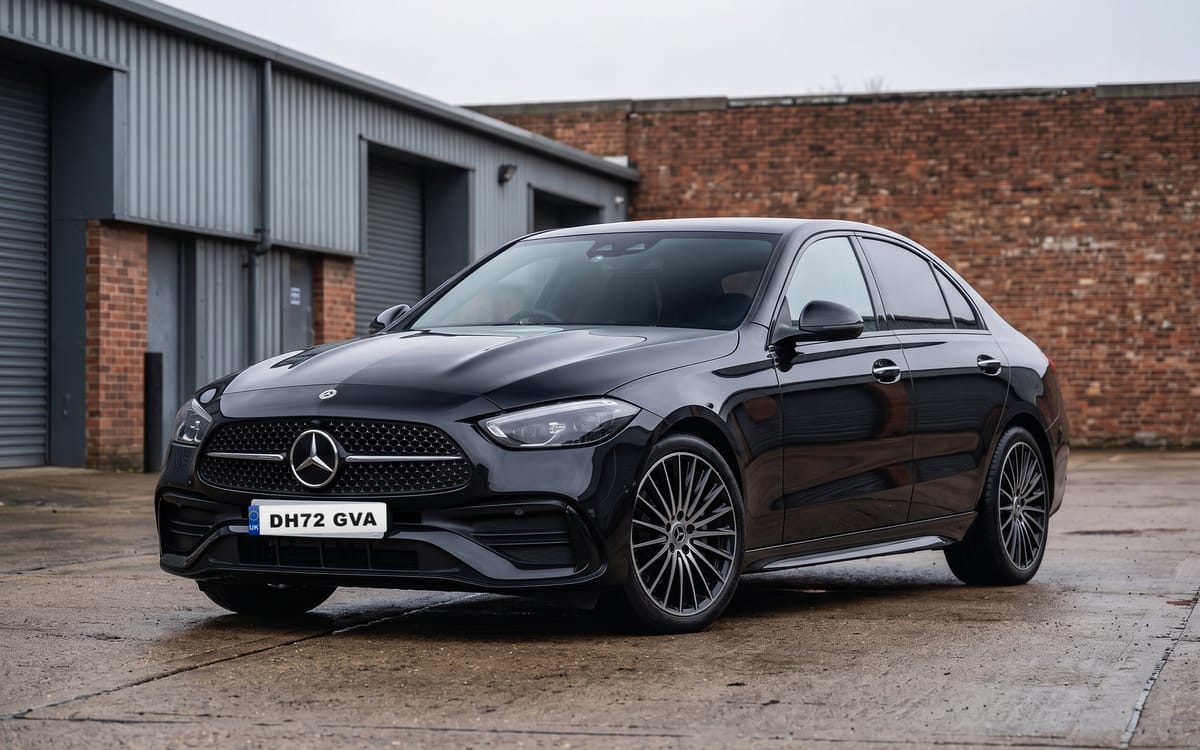 Mercedes-Benz C-Class C 300 e AMG Line Premium Plus in Obsidian Black Metallic, front three-quarter view