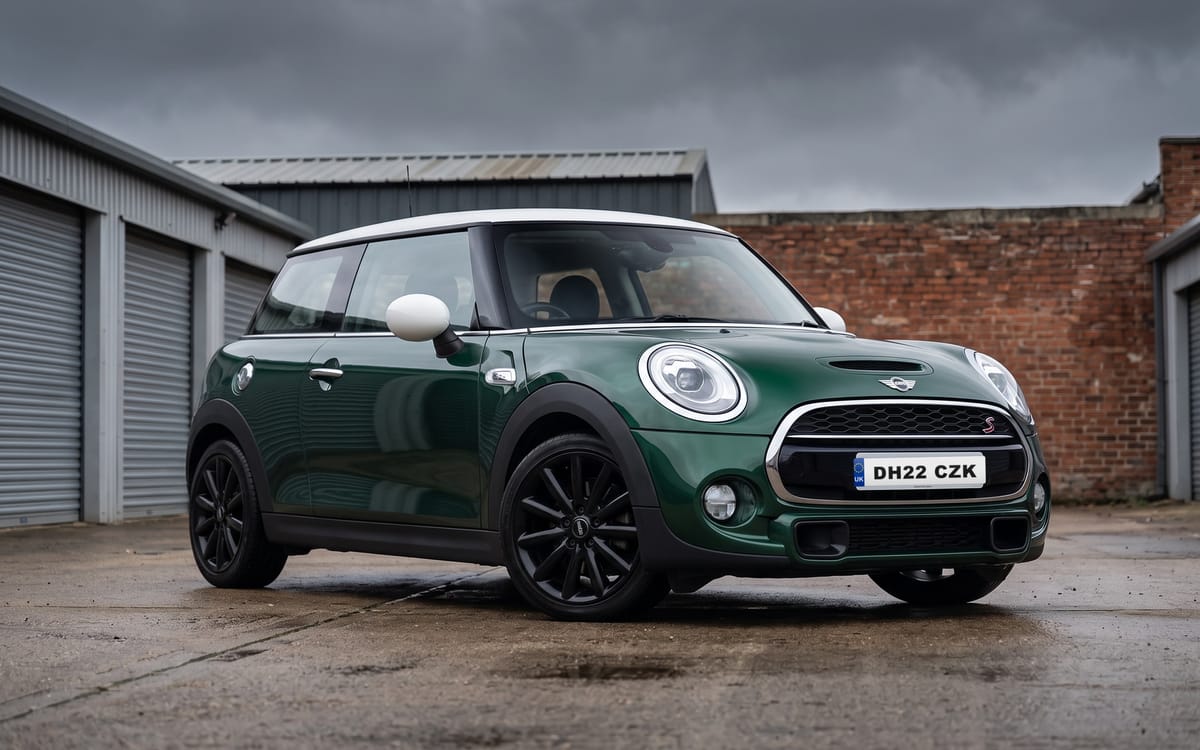 MINI Cooper S 3-Door Sport Manual in British Racing Green IV with white roof and mirror caps, front three-quarter view
