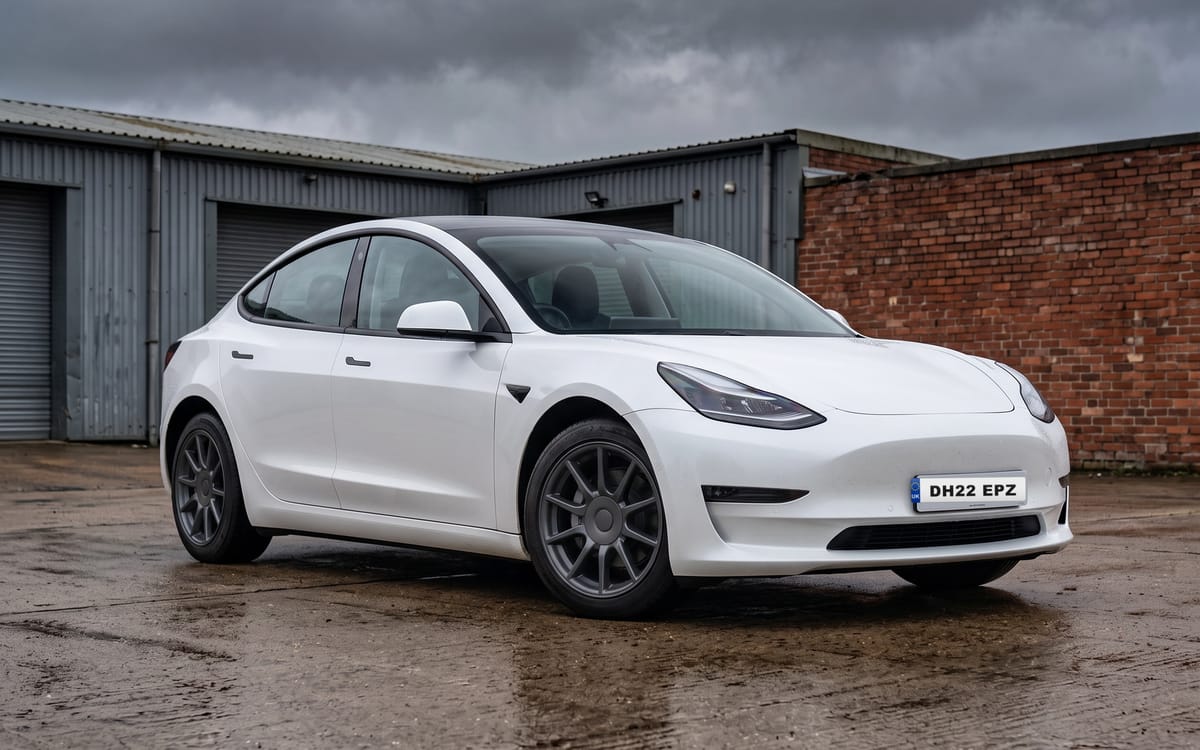 Tesla Model 3 Long Range AWD in Pearl White Multi-Coat, front three-quarter view
