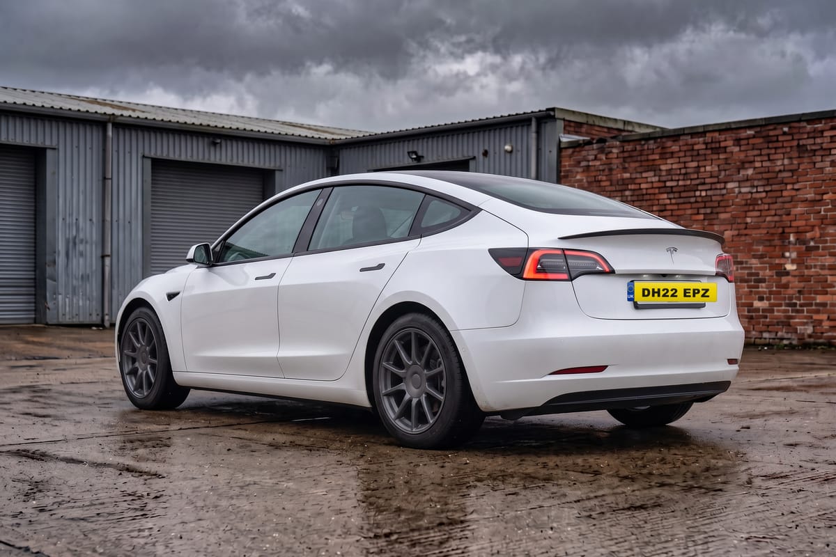 Tesla Model 3 Long Range AWD, rear three-quarter view