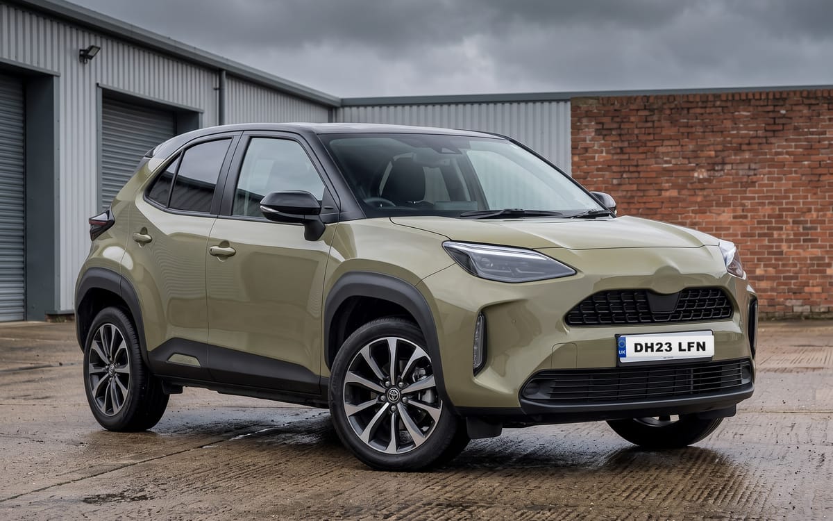 Toyota Yaris Cross 1.5 Hybrid Design in Urban Khaki with black contrast roof, front three-quarter view